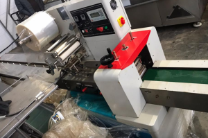 Горизонтальный упаковщик Hualian DXDZ-250B