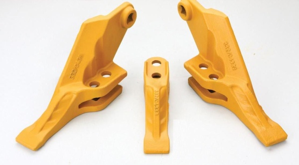 Зубья и бокорезы ковшей экскаваторов-погрузчиков