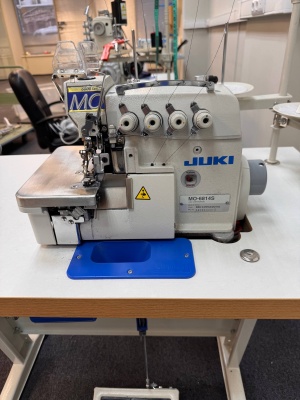 Оверлок четырехнитка JUKI с обрезкой нити, отсосом остатков ткани